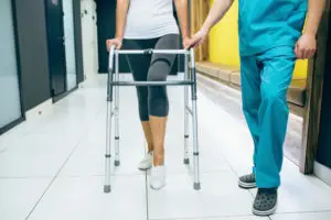 woman using walker to walk again