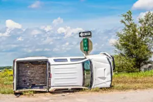 white pick-up truck flipped over