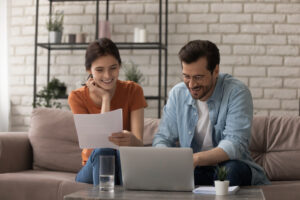 couple happily reviewing paperwork