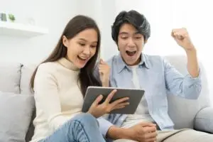excited Asian couple