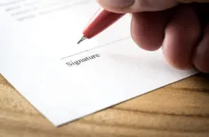 person signing settlement contract