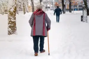 old woman walking on ice