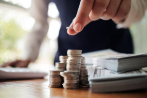 man stacking coins