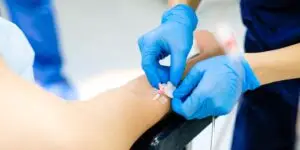 nurse inserting a catheter