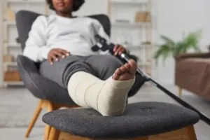 black woman in a foot cast