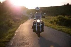 person on motorcycle wearing helmet