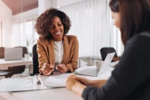 Lawyer meets with client to explain if you can sue someone as a non-citizen.