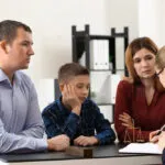 Parents and their son meet with a family law attorney in Cartersville, GA.