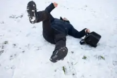 business-man-slips-and-falls-in-snow