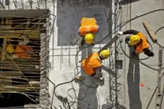 Construction Workers Collaborate On A Worksite