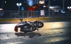 Motorcycle Lying On Side Of Road