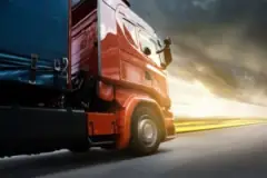 truck-driving-in-highway-at-sunset