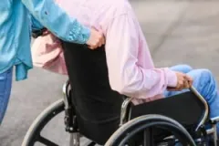 A person in a wheelchair after a spinal cord injury. Discuss your legal options with a spinal cord injury lawyer in Brownsburg, Indiana.