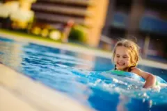 A little girl in a pool. Discuss your legal claim with an Indiana drowning accident lawyer.