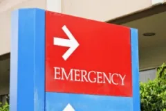A red emergency room sign.