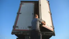 An Amazon truck driver prepares his rig for a long-haul trip through Carmel.