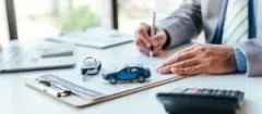 A Plymouth car accident lawyer fills out a personal injury claim for a client