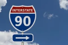 A sign for Interstate I-90. A Valparaiso interstate I-90 accident lawyer can help you secure compensation.
