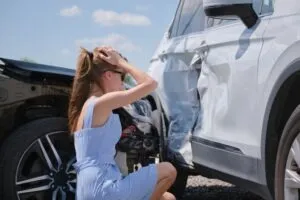 A young driver stresses out over vehicular damage after an Uber accident.