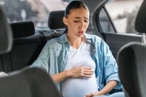 An injured pregnant woman is driven to the hospital after a car crash. She is worried about what to do if she loses her pregnancy due to a car accident.