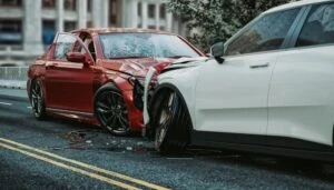 Two cars lie abandoned after a head-on collision.