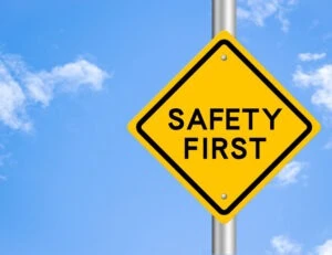 Safety first sign. Learn how to report truck safety violations.