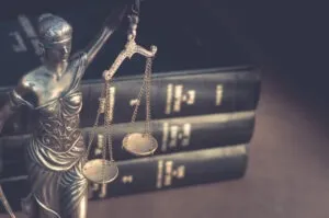 Scales of justice over law books