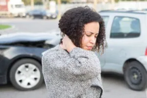 A woman in pain after a car accident. Learn what to do when you get into a car accident that is not your fault.