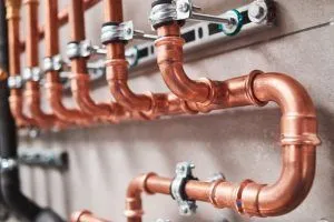 copper pipes that transport water to and from boiler