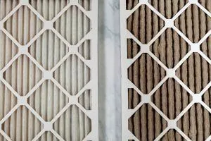 side-by-side close-up view of new and used air filters 