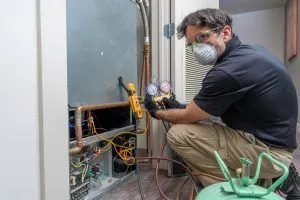 hvac technician conducts routine inspection 