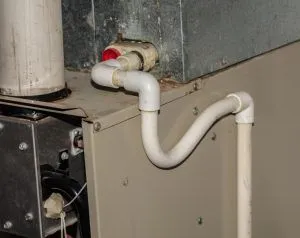 air conditioner drain line runs out of basement