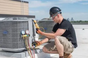 technician-working-on-ac-and-heater-maintenance