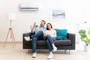 couple enjoying air conditioner