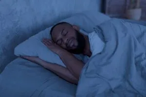 black man trying to sleep
