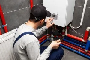 HVAC-repairman-checking-heat