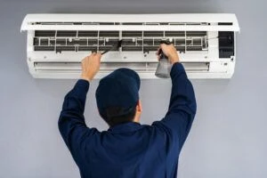 technician installing an air conditioner