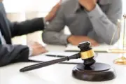 A lawyer explains to a client how Virginia dog bite laws apply to their case.