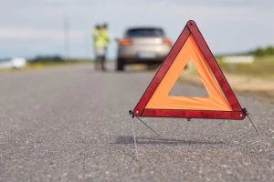 orange safety triangle on the road