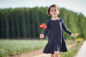 young girl with flowers, outside