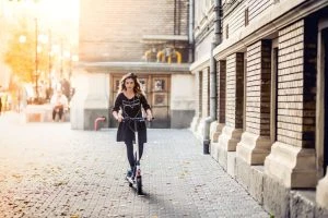 Girl riding e-scooter