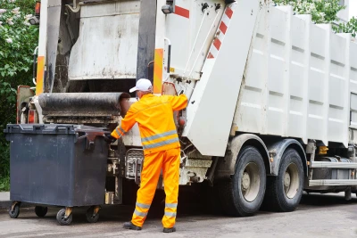 man and garbage truck