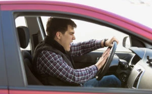 man driving aggressively