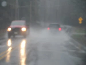 cars driving in the rain