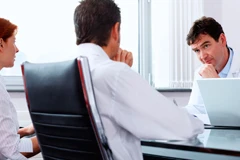 Doctors sitting at table