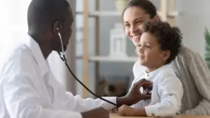 doctor checking a child patient