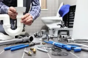 plumber working with tools