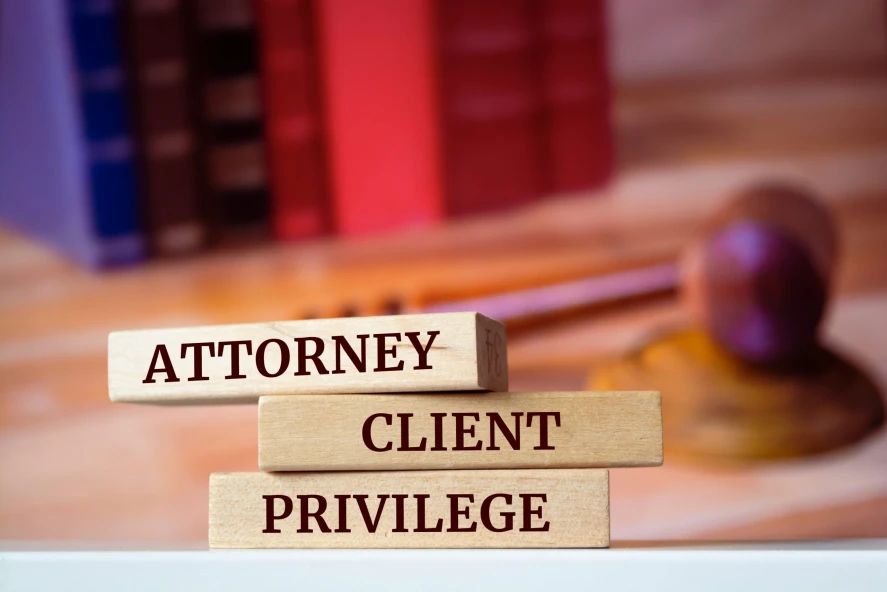 Wooden blocks read ‘lawyer client privilege’. Is lawyer-client privilege applicable in medical license defense cases?