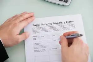 Man filling out Social Security disability application