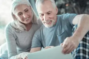 happy older couple looking over their finances
